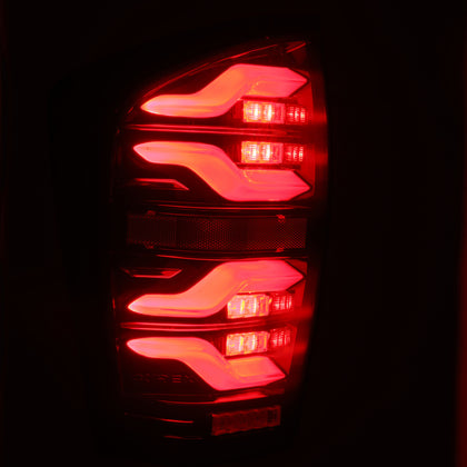 AlphaRex 16-21 Toyota Tacoma LUXX LED Taillights Blk/Red w/Activ Light/Seq Signal